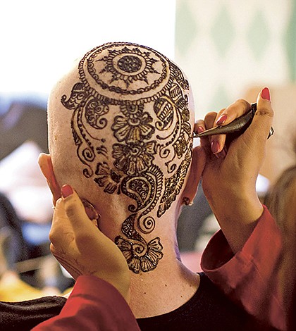 Artist designs henna pieces for cancer patients
