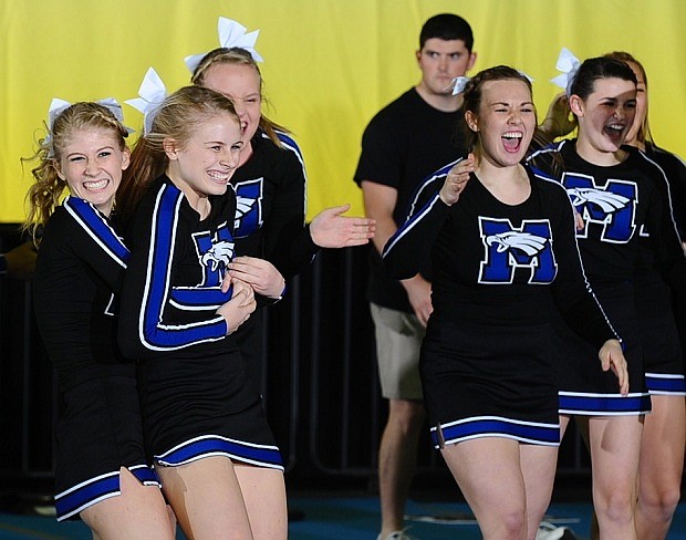 The Master's Academy cheerleading team celebrates after their win at the Florida High School Athletic Association Competitive Cheerleading Championship.