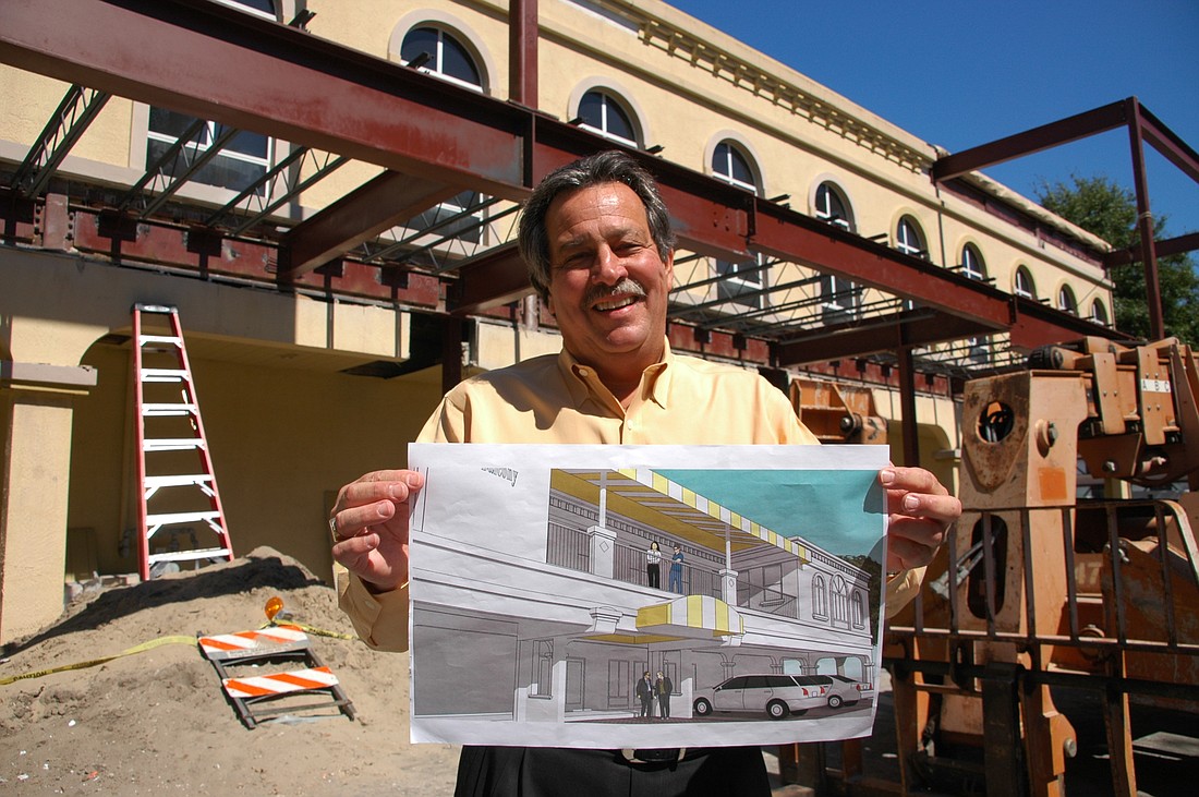 Photo by: Isaac Babcock - George Williston, manager of the popular Maitland eatery, holds up plans for the expansion, which will also include additional parking and a valet service.