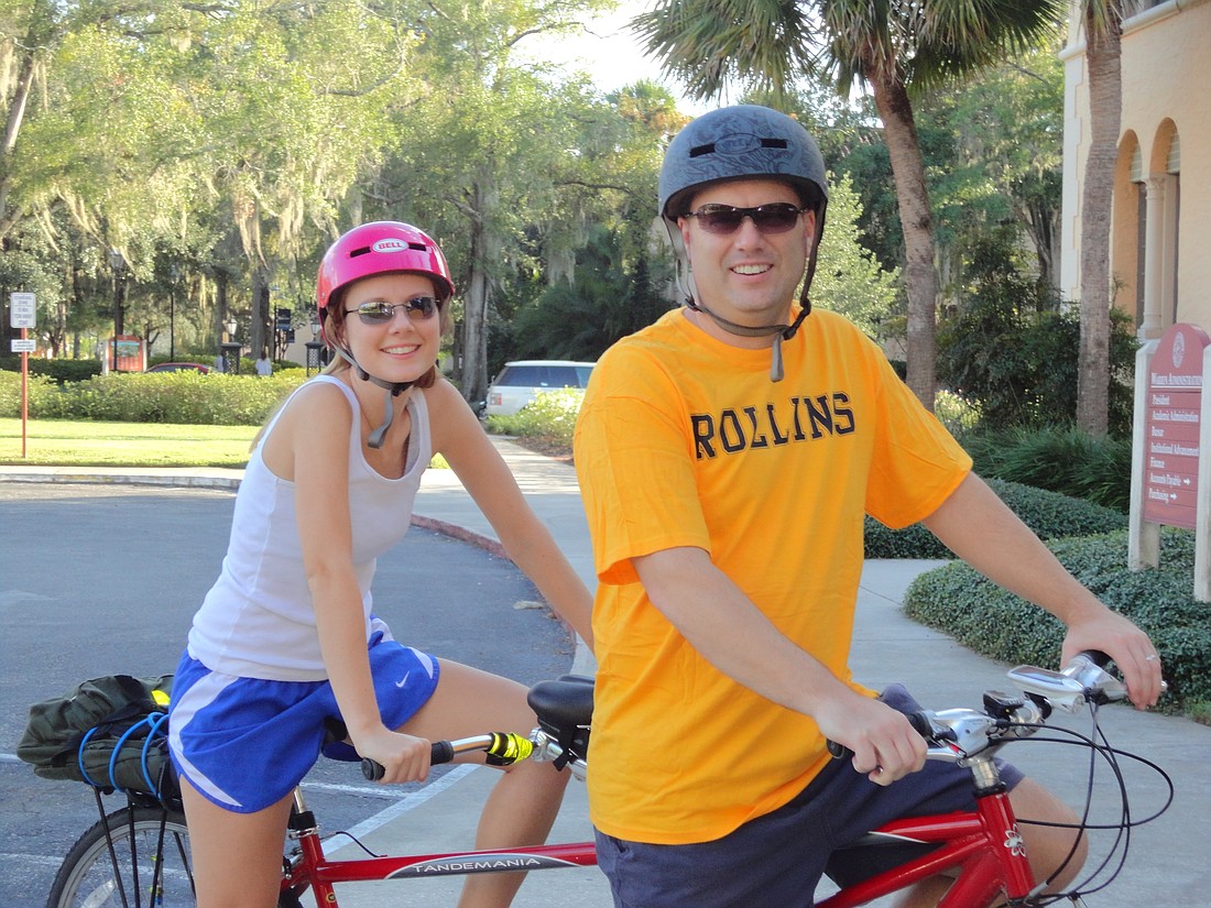Photo by: Isaac Babcock - Mandy and Steve Booker bike from their Oviedo home to their jobs at Rollins College all along.