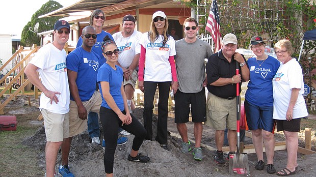 Photo by: CENTER FOR INDEPENDENT LIVING - CNL Bank employees, with the CIL, helped build a ramp for a senior veteran.