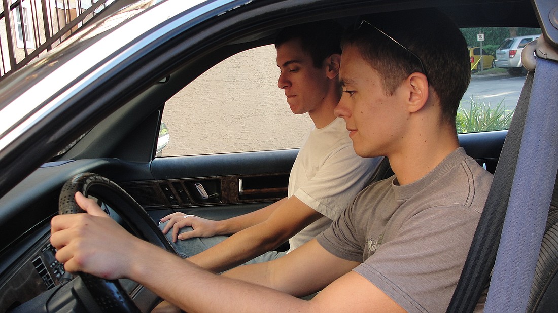 Photo by: Kerri Anne Renzulli - Brian Troili, 20, and Sean Mawn, 20, use UCF's Zimride program to carpool to their ROTC physical training three times a week.