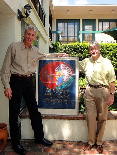 Photo by: Chris Jepson - Chris Jepson and Hardy Hudson stand with a Maury Hurt print commemorating the 1973 art festival.