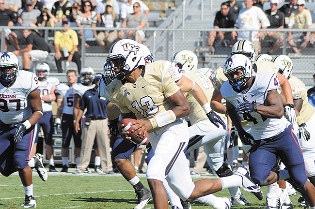 Photo by: Isaac Babcock - UCF quarterback Justin Holman will lead the Knights onto their home field at 6 p.m. today as they battle a struggling Florida International University team.