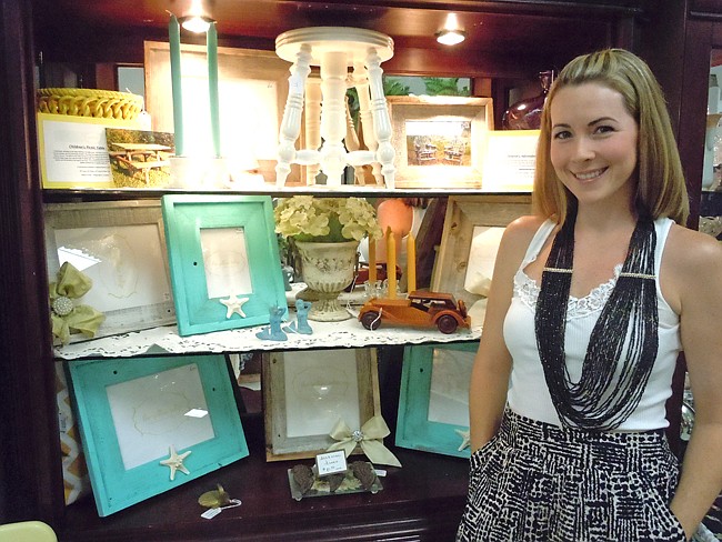 Photo by: Clyde Moore - Ashley Hall stands with a selection of her picture frames and refurbished antique items at Lily Lace Antiques in Maitland.
