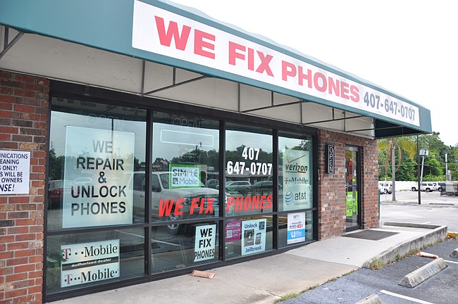 Photo by: Tim Freed - The owner and three employees of We Fix Phones have been charged with multiple counts related to the alleged purchase of stolen cellphones at the Winter Park business.