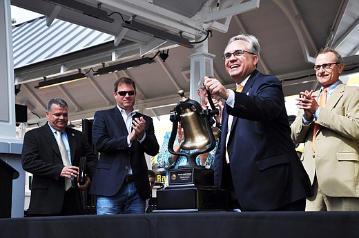 Photo by: Tim Freed - Mayor Ken Bradley rings the bell at the first arrival of the SunRail train in Winter Park. He has served two terms as mayor in Winter Park. He will not seek a third term.