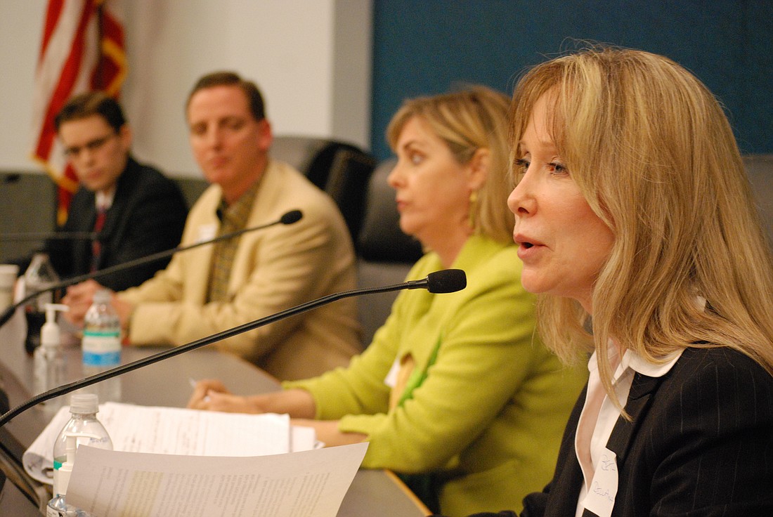 Photo by: Abraham Aboraya - Winter Park City Commissioner Beth Dillaha, right, defends Amendment 4 at a forum held in Sanford on March 17.