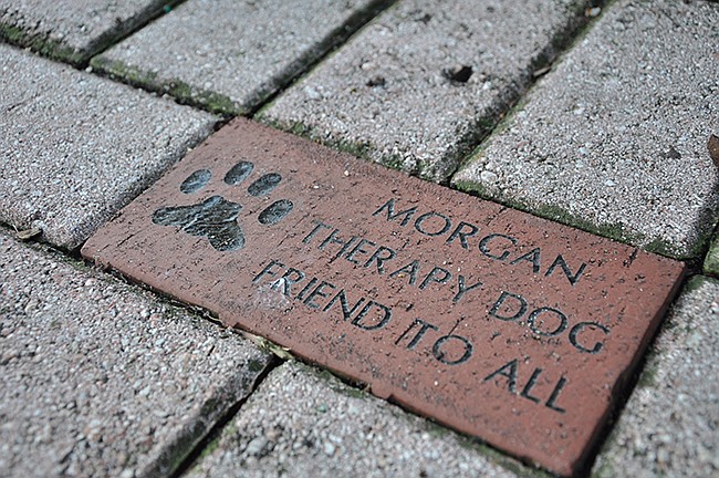Photo by: Tim Freed - Bricks in honor of pets similar to this one at the Winter Park Farmers Market could be a backup plan for a Lake Baldwin memorial.