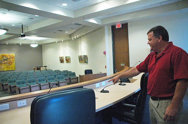 Photo by: Isaac Babcock - Winter Park City Manager Randy Knight shows some new screens up on the City Commission dais in the renovated City Hall, which will officially reopen Aug. 27.