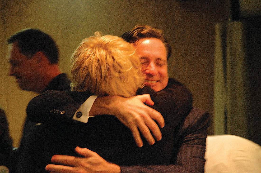Photo by: Isaac Babcock - Maitland Town Center developer Bob Reese hugs a supporter after the development agreement was approved in 2007. At the Maitland City Council meeting on Monday, that agreement was declared in default and is headed for terminat...