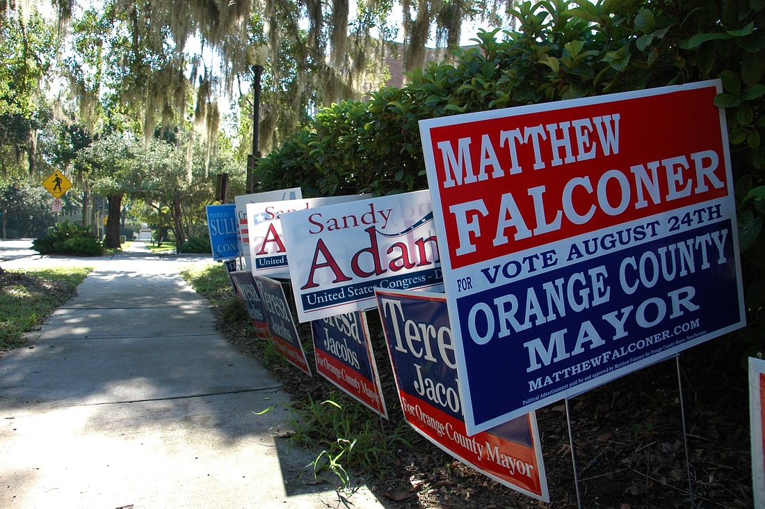 Photo by: Isaac Babcock - Campaign signs dot the streets of Winter Park, as the candidates scramble for votes leading up to Tuesday's primary.
