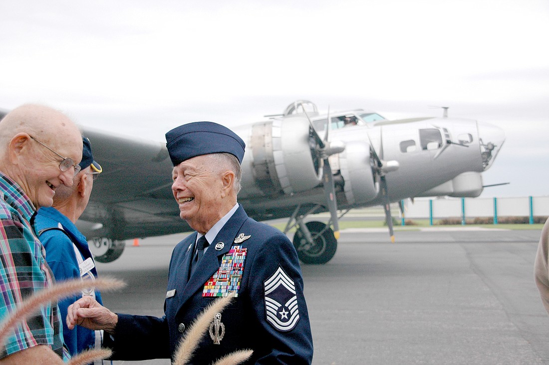 Photo by: Isaac Babcock - Chief Master Sgt. Richard Ortega, at right, spent two months on the front lines in World War II, earning seven purple hearts and four bronze stars. Now his daughter is retelling his tale of luck and survival during the most f...