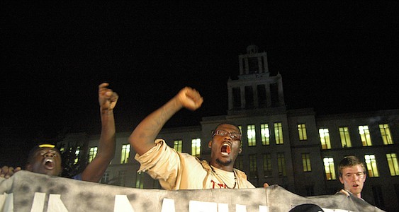 Photo by: Isaac Babcock - Keith Mack from the Coalition for Justice for Trayon, center, shouts in protest outside Seminole County Courthouse, moments after protestors learned that George Zimmerman was found not guilty of second degree murder. Zimmerma...
