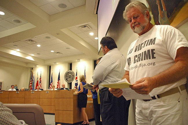 Photo by: Isaac Babcock - Mark Schmidter waits to speak in opposition to a controversial ordinance banning protesting in neighborhoods at the Winter Park City Commission meeting Sept. 24.