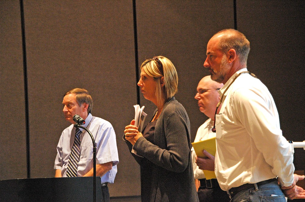 Photo by: Isaac Babcock - Ravaudage developer Dan Bellows, right, listens to the Winter Park City Commission during a discussion about his project March 26.