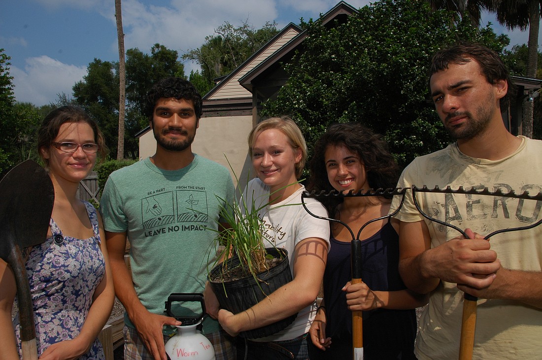 Photo by: Isaac Babcock - Kristin Urban, Shan Kasal, Megan Frederick, Yarissa Matos-Soto and Robert Watson show off their sustainable gardening tools in front of the Mowbray House, a five-bedroom home on Lake Virginia.