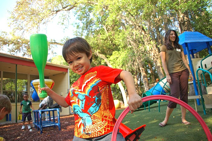 Photo by: Isaac Babcock - Five-year-old Caden enjoys the playground at the Winter Park Day Nursery, which charges parents for care based on a sliding scale of income. The school is hosting its 11th Orange Blossom Jubilee to raise money for care on Apr...