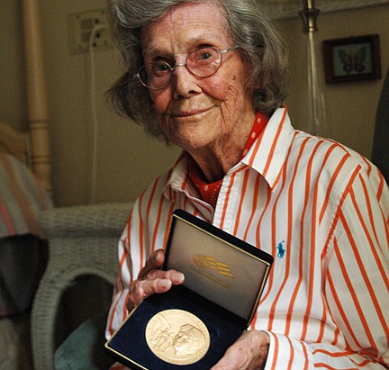 Photo by: Isaac Babcock - Patricia Erickson shows her Congressional Gold Medal, awarded to her for contributing to the Women Airforce Service Pilots program, volunteering her flying skills to help the World War II efforts.