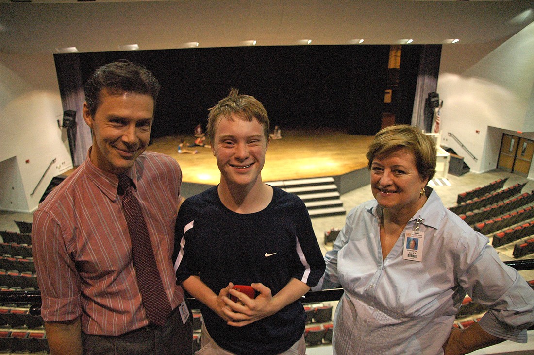 Photo by: Isaac Babcock - Sam Hagan has made a school full of friends while excelling at a slew of extra-curricular activities at Winter Park High School. Pictured with him are drama teacher Robert Dutton and aide Sharon Riley.