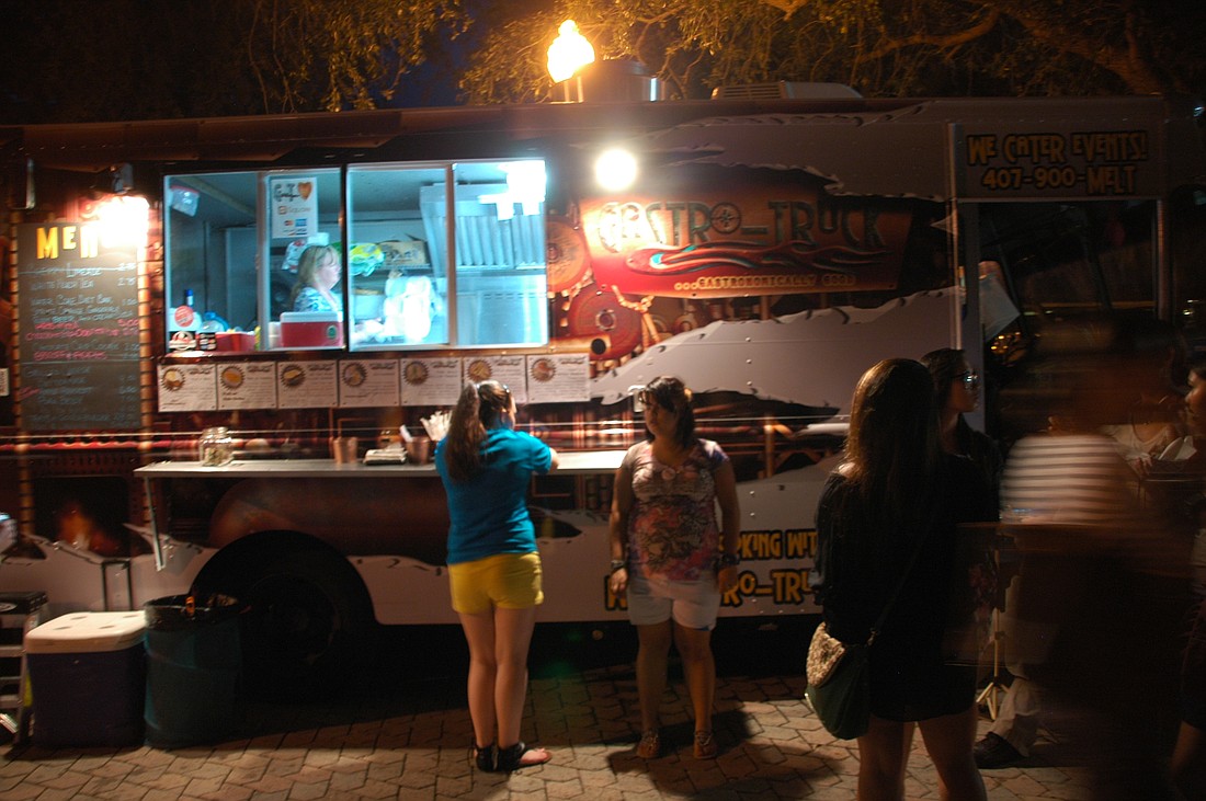Photo by: Isaac Babcock - Patrons flooded Maitland's Lake Lily Park for food truck cuisine Sept. 20.