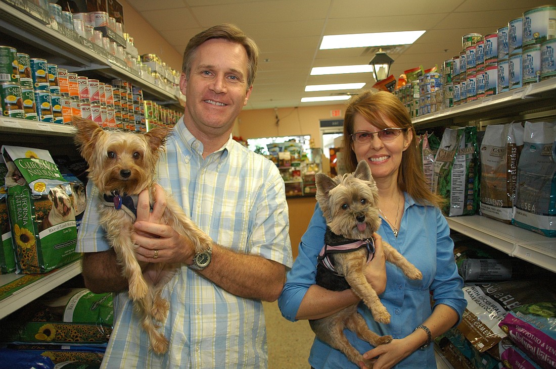 Photo by: Isaac Babcock - Hounds and Kitties pet health food market owners Andre and Kerry Elliott say health-conscious people are becoming health-conscious pet owners.