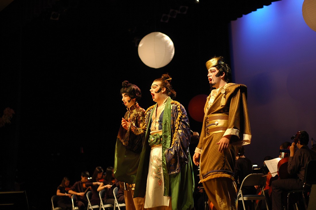 Photo by: Isaac Babcock - John Allen co-stars as Koko, center, in Trinity Prep's production of "The Mikado." The performance was dedicated to Jonathan May, the school's conductor, who died during the play's production in February.