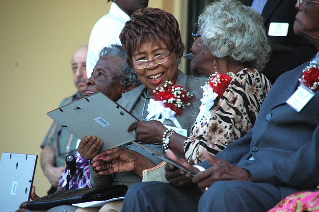 Photo by: Isaac Babcock - Honoree Bessie Davenport, left, talks with Katrene Bentley at the unveiling of the Sage Project in Winter Park May 11.