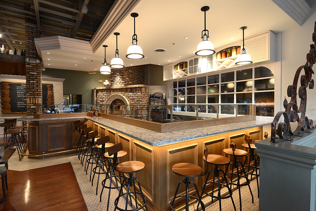 Photo by: Schmidt Design Studio - Schmidt Design Studio designed the 150-seat Cask & Larder's restaurant and brewery to provide patrons with a sense of casual Southern elegance with white panes of weathered oak and whitewashed shutters.