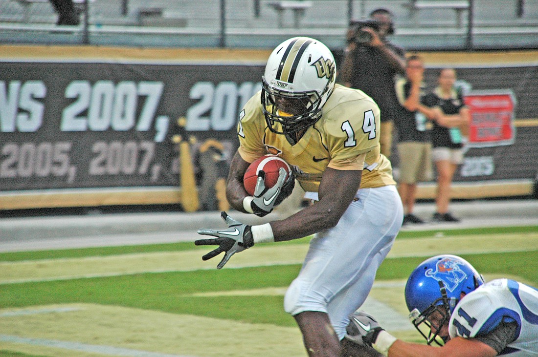 Photo by: Isaac Babcock - Quincy McDuffie carries the ball for one of UCF's five touchdowns against Memphis Oct. 29.