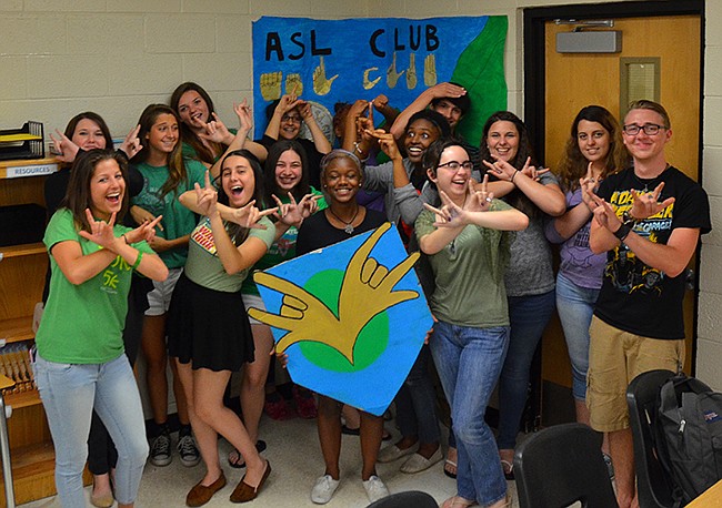 Photo by: Sam Schaffer - Teacher Ashley Loomis, far left, launched WPHS's new Sign Language Club, which is gaining support amongst the student body.