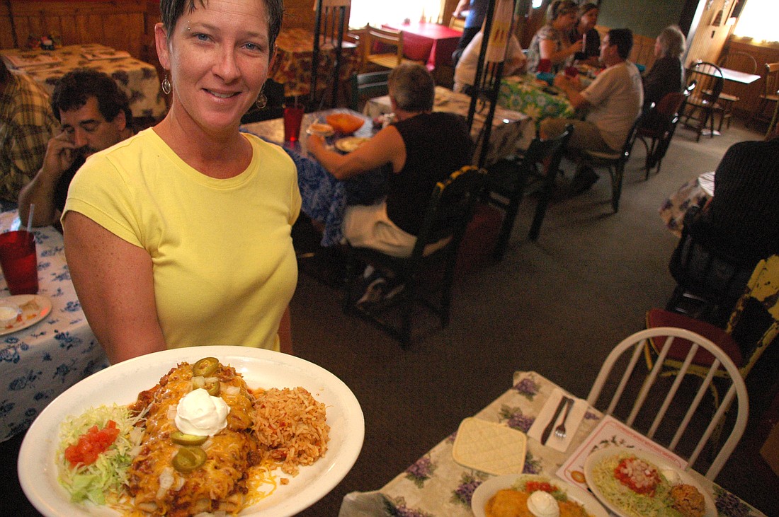 Photo by: Isaac Babcock - Monica Myers knows all of her customers at Paco's Mexican Restaurant in Winter Park, which has been open for 30 years.