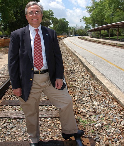 Photo by: Isaac Babcock - Winter Park Mayor Ken Bradley stands at the future site of Winter Park's SunRail station. Some commissioners want the option to move the station if it becomes tough for shoppers and diners to make their way to Park Avenue.