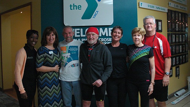 Photo by: TIM FREED - Roy Roden, center, biked 4,500 miles across America before stopping by the Winter Park Crosby YMCA to meet with a group of cyclists who are battling Parkinson's disease. A study showed that Parkinson's patients can reduce their s...