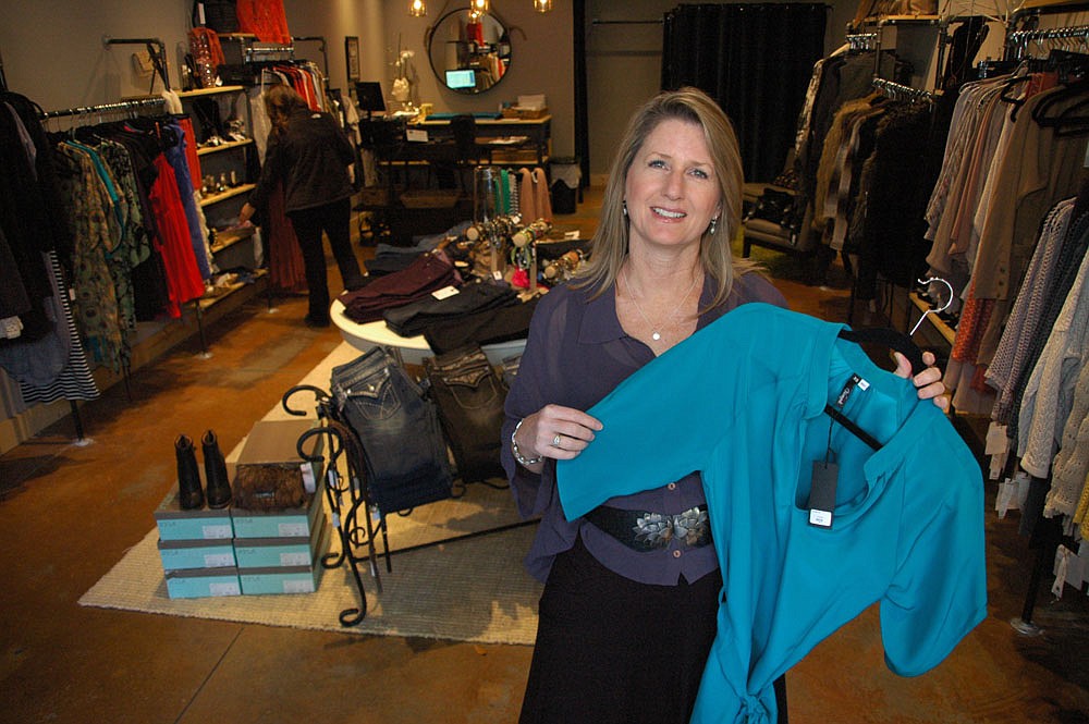 Photo by: Isaac Babcock - Charyli's Lisa West is living her fashion dreams after raising four children, opening her first clothing store.