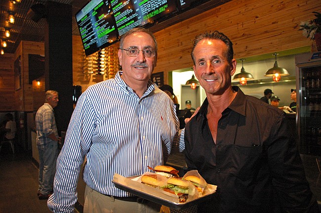 Photo by: Isaac Babcock - BurgerFi in Winter Park celebrated its pre-grand opening on Sunday with owning partners Henry Talerico, left, and Jim Pagano, right.