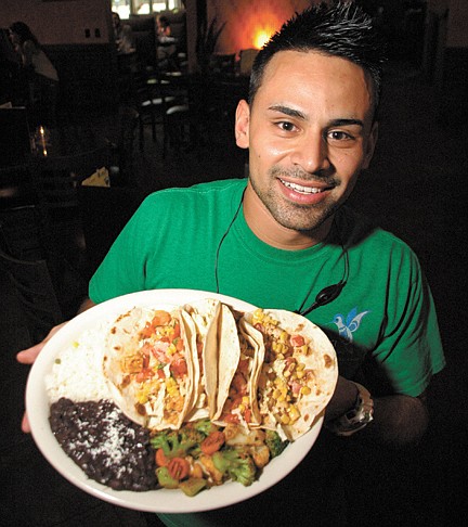 Photo by: Isaac Babcock - Manager Ricky Galicia shows off a dish of authentic Mexican tacos at Colibri in Baldwin Park.