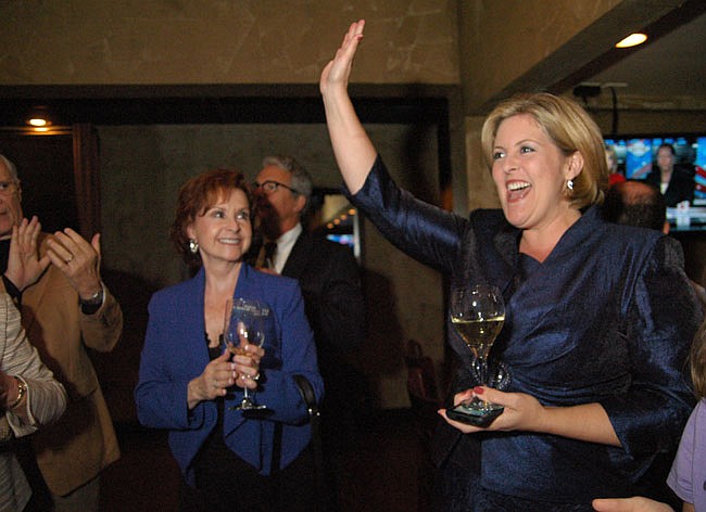Photo by: Isaac Babcock - Karen Castor Dentel celebrates her victory on Tuesday night at SoNapa Grille in Maitland.