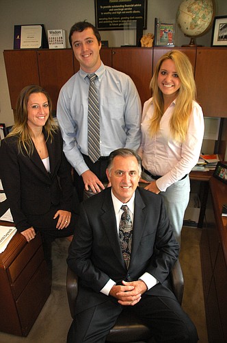 Photo by: Isaac Babcock - The Grafton family financial planning business has continued to grow, defying national trends.