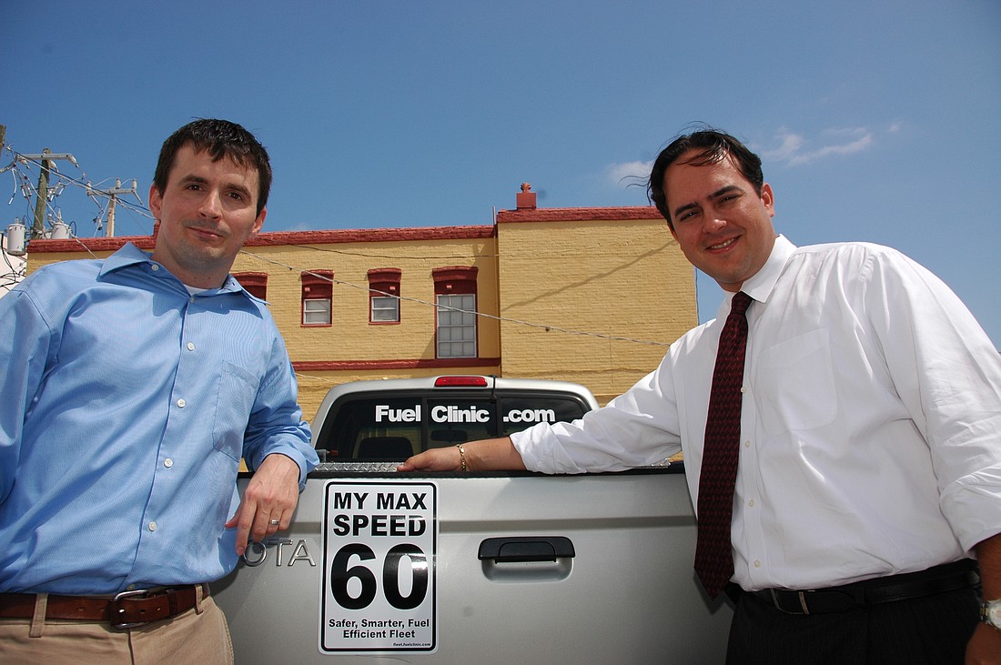 Photo by: Isaac Babcock - Michael Bragg, left, started FuelClinic.com to monitor driving habits wirelessly from a CarChip, which helps drivers save money.