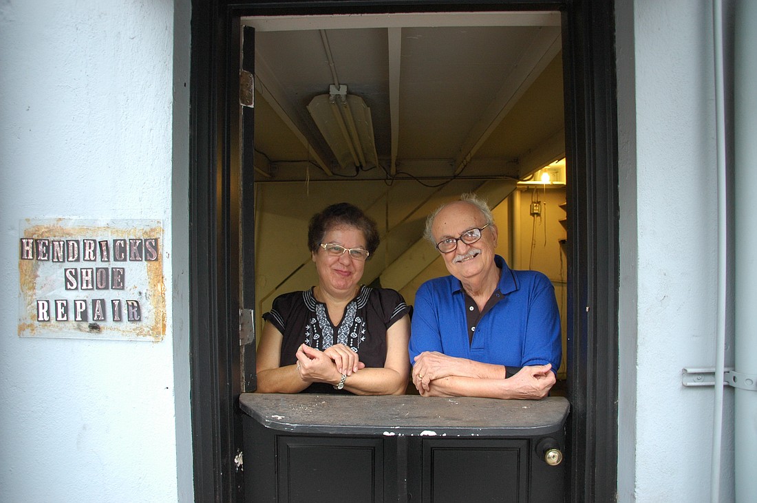 Photo by: Isaac Babcock - Luther Shakarji, right, and his wife, Clare, reflect on the last three decades on Thursday, Sept. 30, their last day in business. They will miss the community but look forward to retirement.