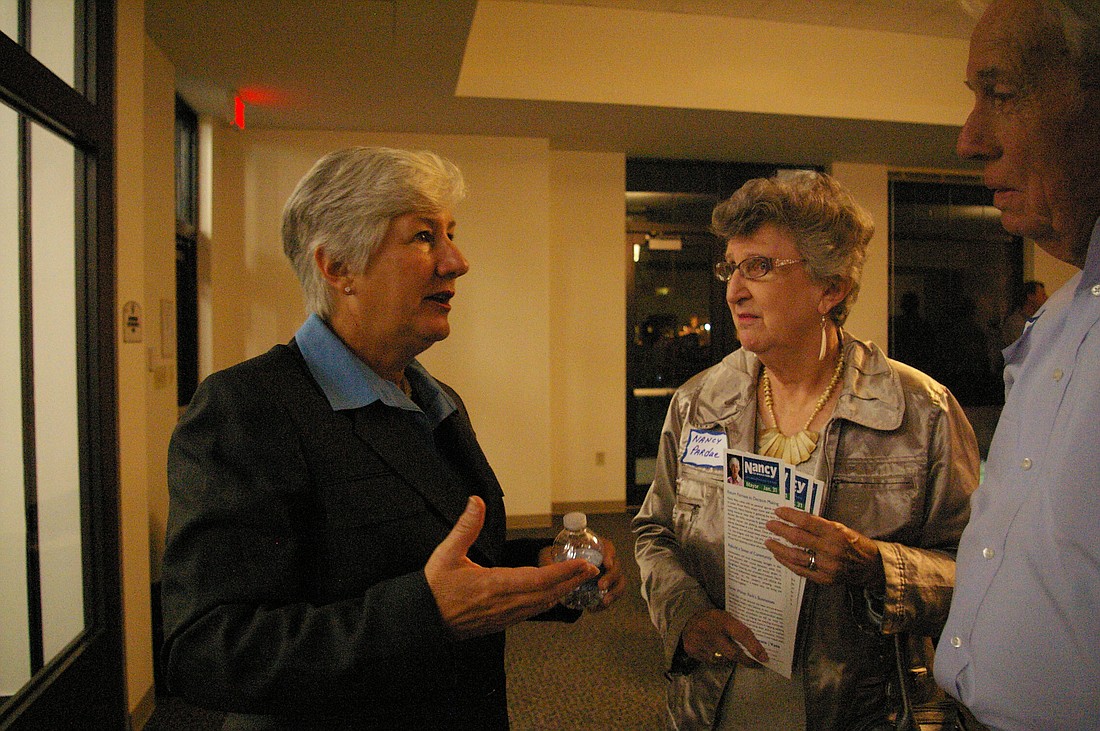 Photo by: Jenny Andreasson - Winter Park mayoral candidate Nancy Miles talks with supporters at her campaign kickoff party Dec. 5.