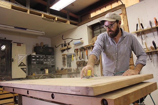 Photo by: Sarah Wilson - From an ever-expanding warehouse in Winter Park, Hog Eat Hog designers and craftsmen dedicate themselves to creating custom furniture pieces that respect the integrity of the locally-sourced wood they work with.