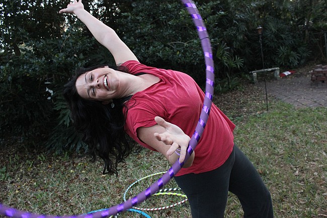 Photo by: Sarah Wilson - Morgan Kennedy changed her life with hula hooping, and turned it into a business.