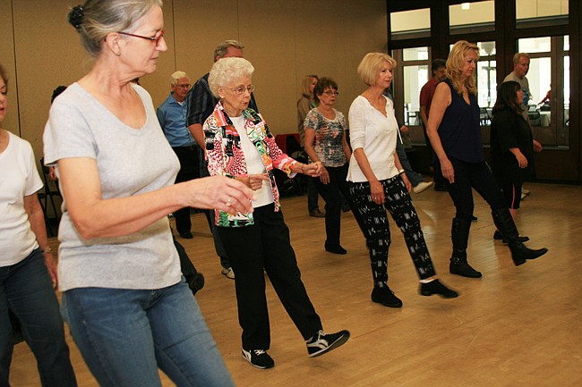 Photo by: Allison Olcsvay - Line dancing lessons help seniors get back in their groove, and help prevent memory loss.