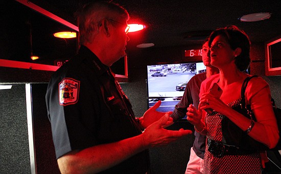 Photo by: Sarah Wilson - Police Chief Doug Ball offered residents a tour of the city's new mobile command center June 24, showing off its high-tech interior.