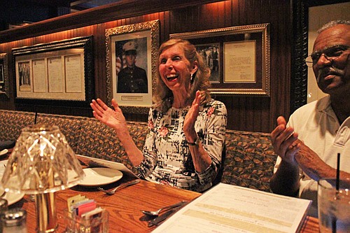 Photo by: Sarah Wilson - Bev Reponen celebrates with supporters at her victory party on March 11.