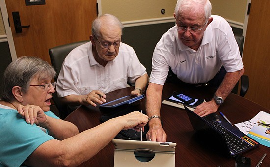 Photo by: Sarah Wilson - Tech-hungry members of the Village on the Green e-communications committee study up on new advancements in tablet and mobile technology at the Longwood retirement home.