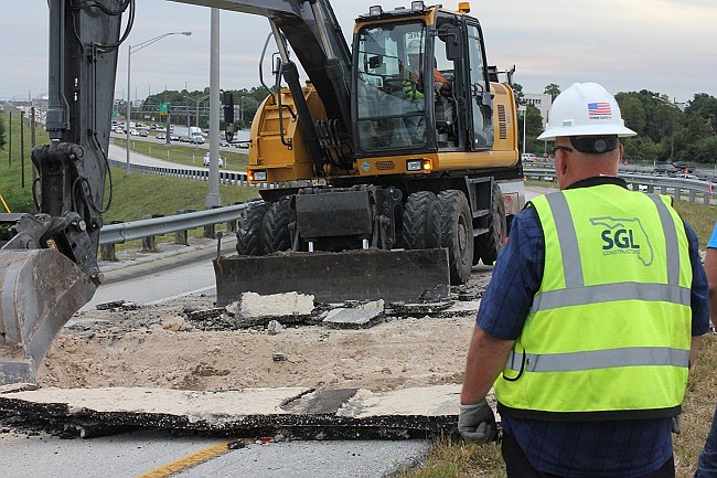 Photo by: Russ Handler - A 15-foot wide, 4-foot deep hole closed the eastbound Interstate 4 Maitland Boulevard exit ramp on Monday, Oct. 26.