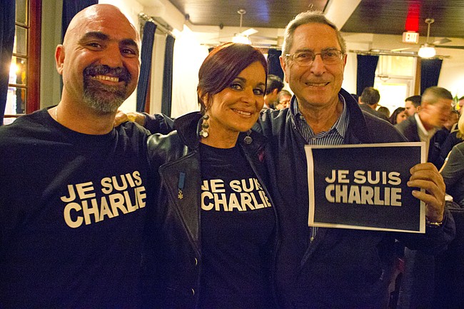 Photo by: Sarah Wilson - Vincent Gagliano, left, the owner of Chez Vincent in Winter Park, hosted a Je Suis Charlie rally on Jan. 15. Brigitte Dagot, middle, and Bernard LoddÃ©, right, both spoke at the event.
